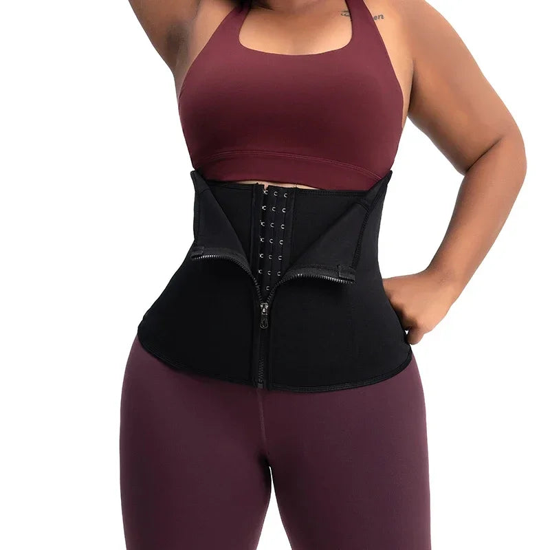 Black body shaping waist trainer worn over activewear – back view showing zipper and hook closure – REYVA